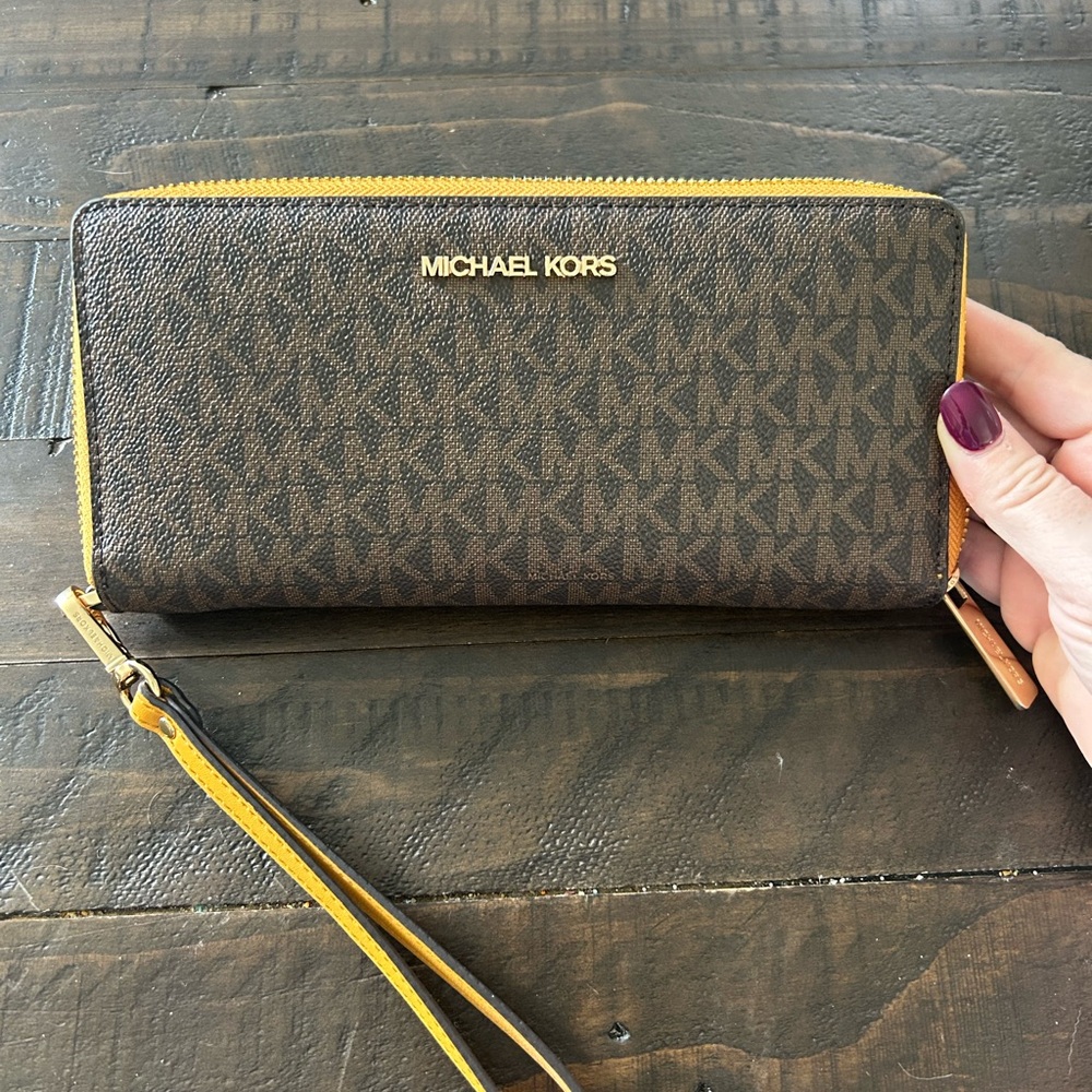 Michael Kors Brown Monogram Zip-Around Wristlet with Yellow Trim